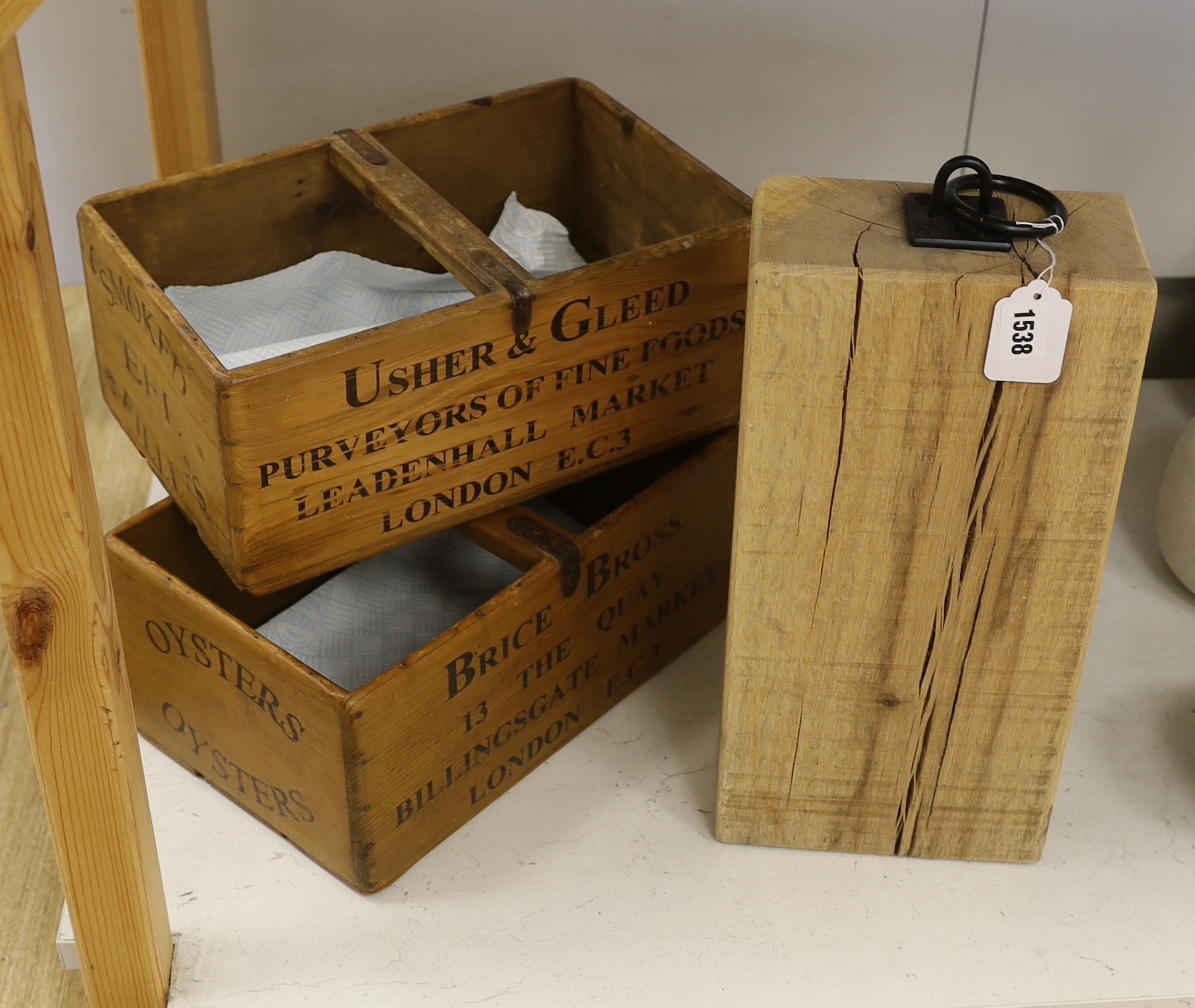 Wooden ware, an Usher &Gleed Fine Foods box and a Brice Bross, Billingate Market box, together with a large wooden weight, weight 40cm high